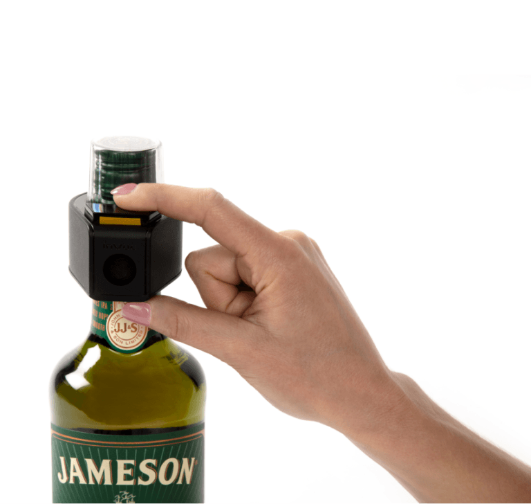 Tapón de botella con una llave para la seguridad de la mercancía en el punto de venta