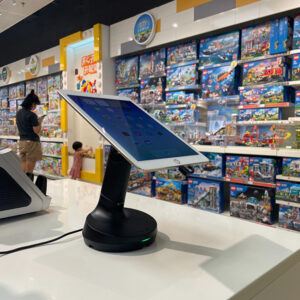 Tablet on Black Security Device in Lego Store